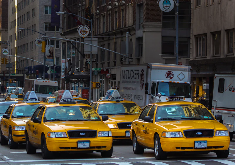 A fleet of taxis on a city street