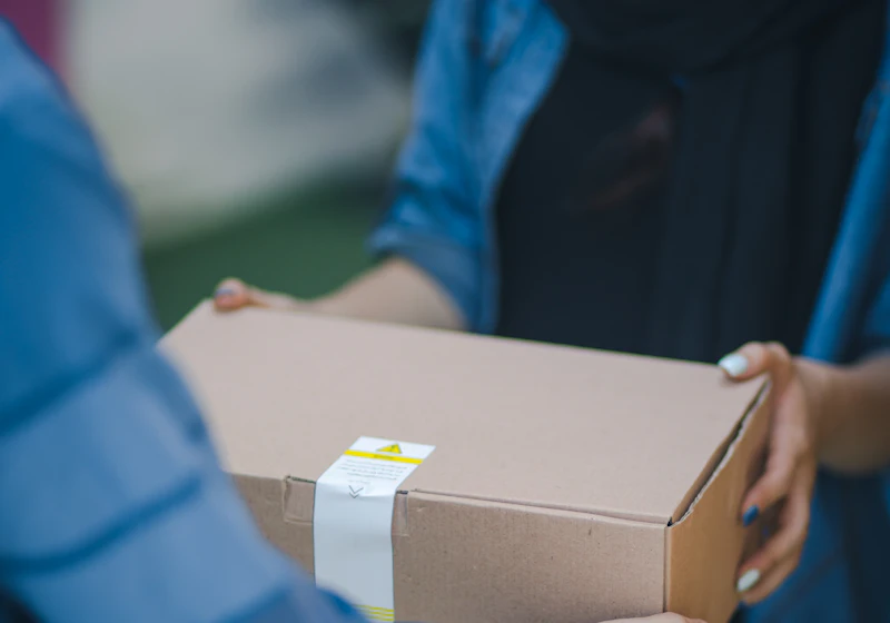A parcel being handed over at the door